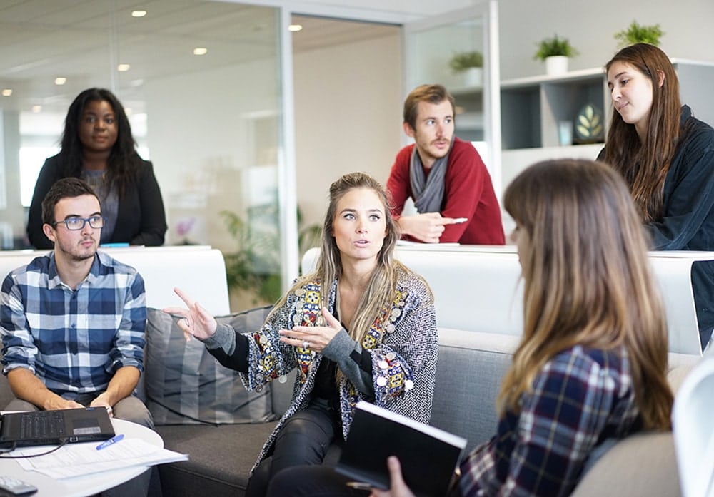 Group of young individuals in business meeting